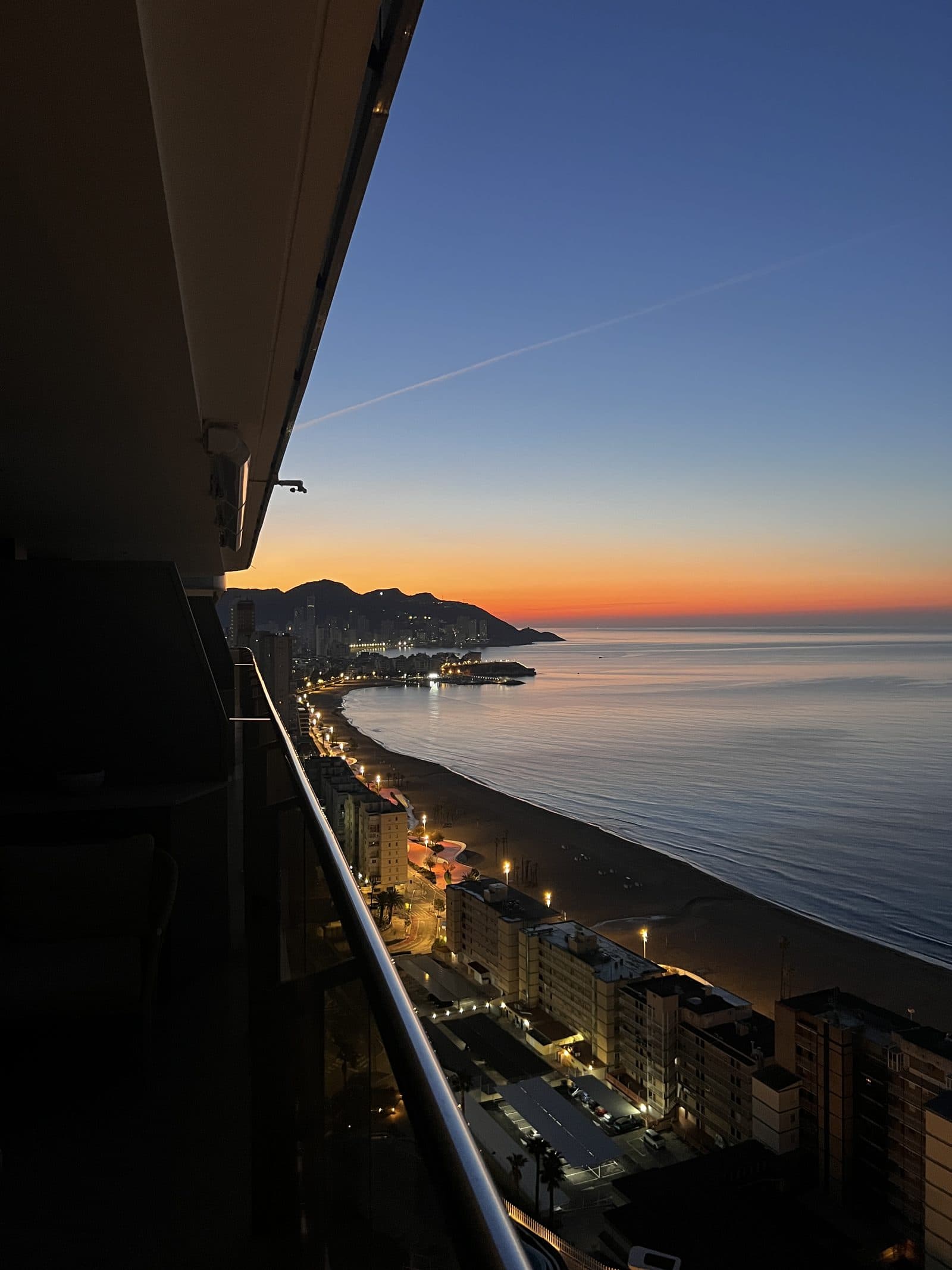 Sunset over Benidorm skyline from the 18th floor balcony on our first evening