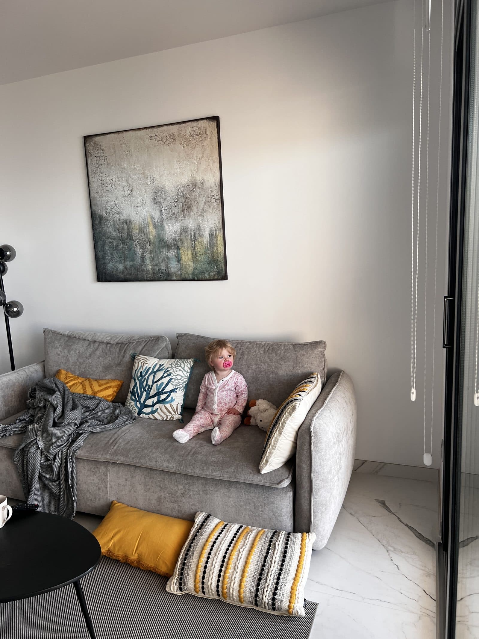 Tallulah settled on the sofa in her pyjamas on our first night in the Benidorm apartment