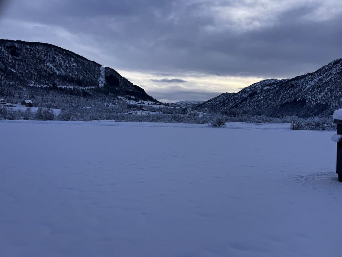 View from Myrkdalen Hotel showing snow-covered Norwegian valley with mountains either side