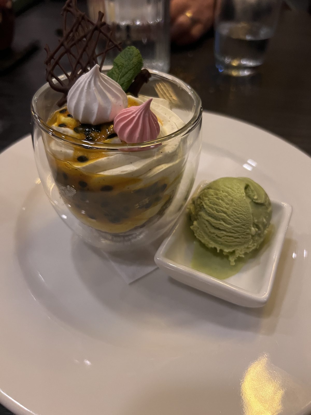 Passionfruit dessert with pistachio ice cream and meringue