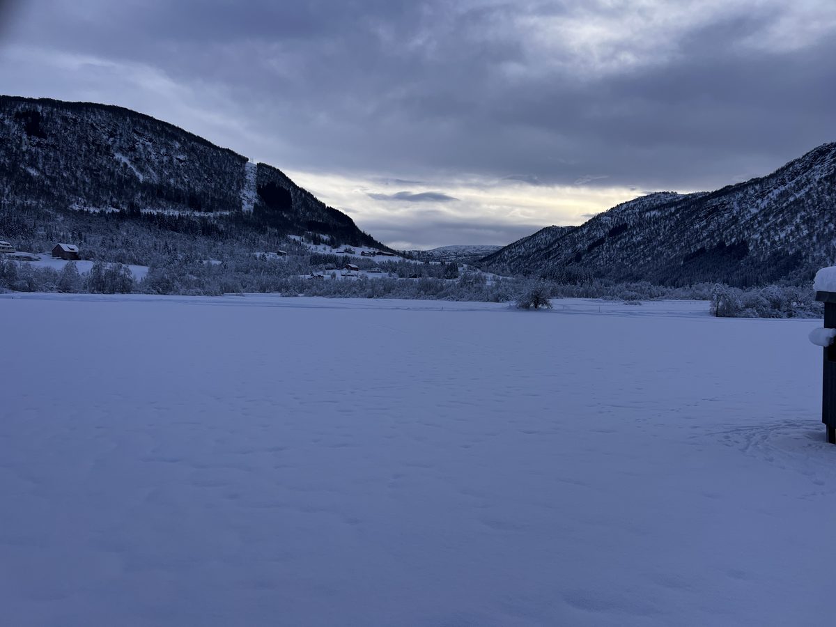 View from Myrkdalen Hotel showing snow-covered Norwegian valley with mountains either side